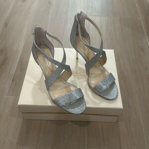 Brand new, Vince Camuto never worn evening shoe in Silver. Includes dust bag.